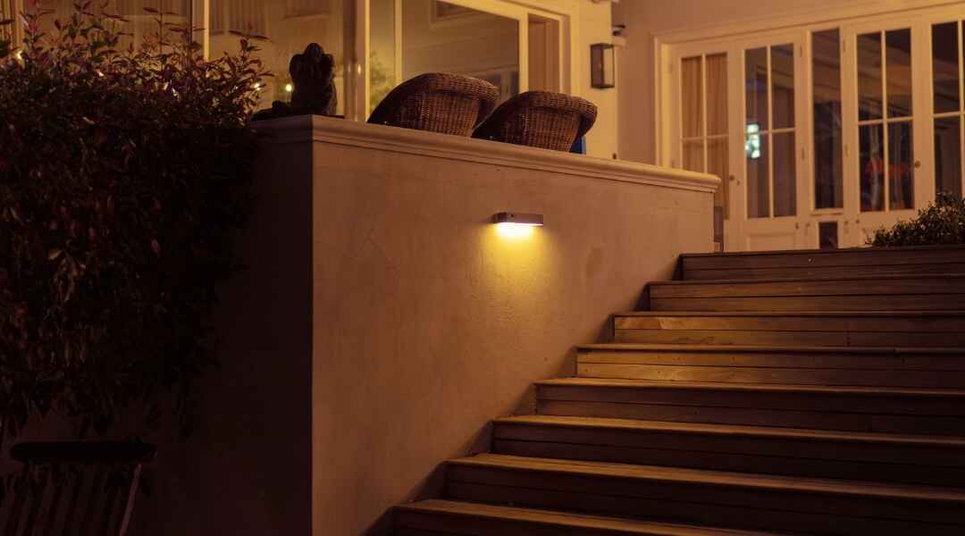 wall light illuminating the staircase of a house 